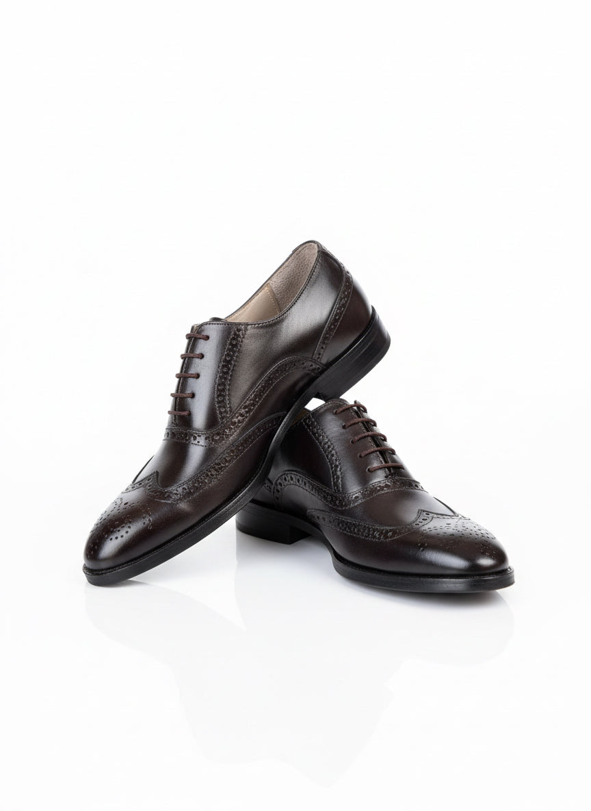 Brown wingtip oxfords with brogue detailing