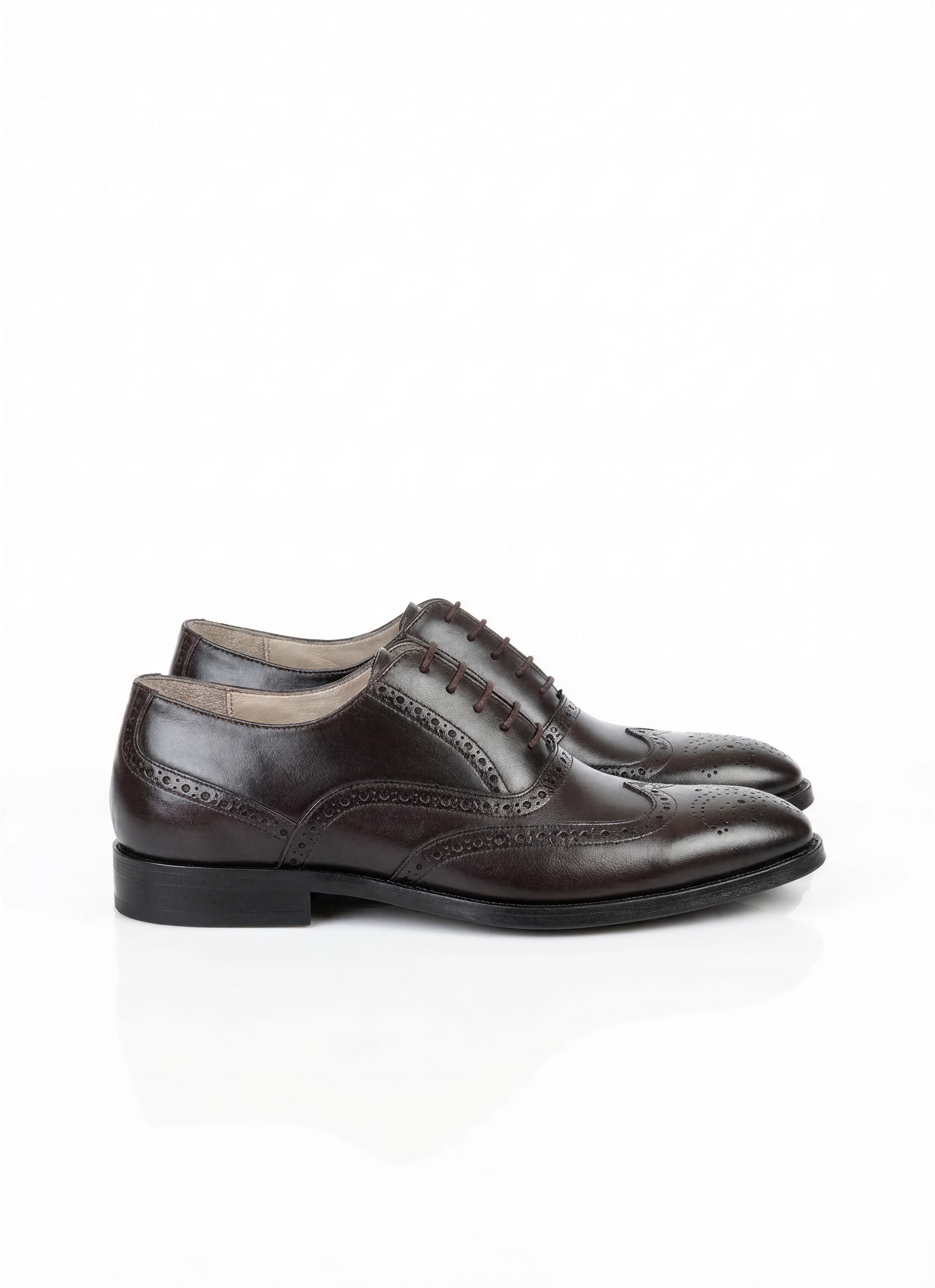 Brown wingtip oxfords with brogue detailing
