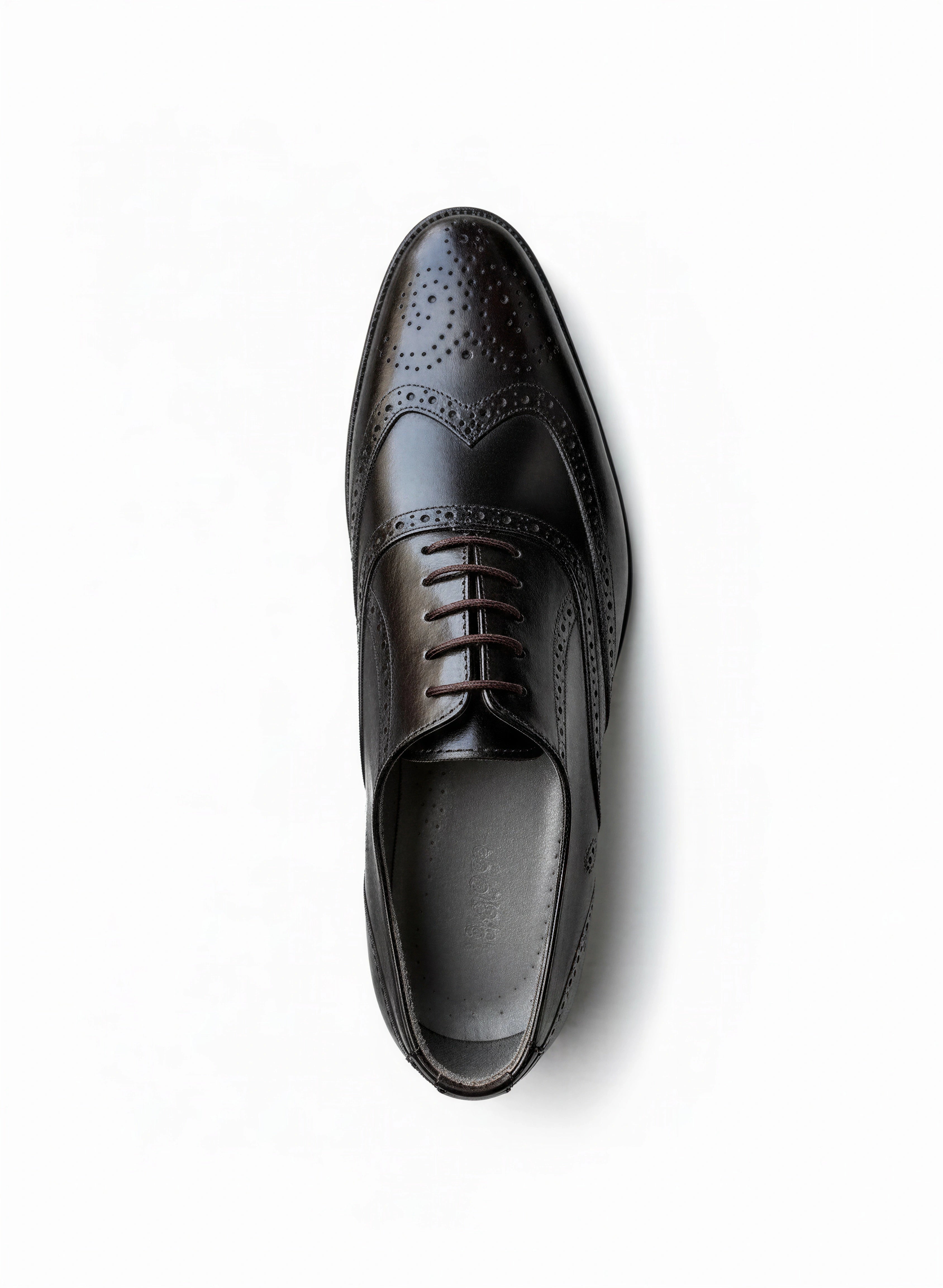 Brown wingtip oxfords with brogue detailing